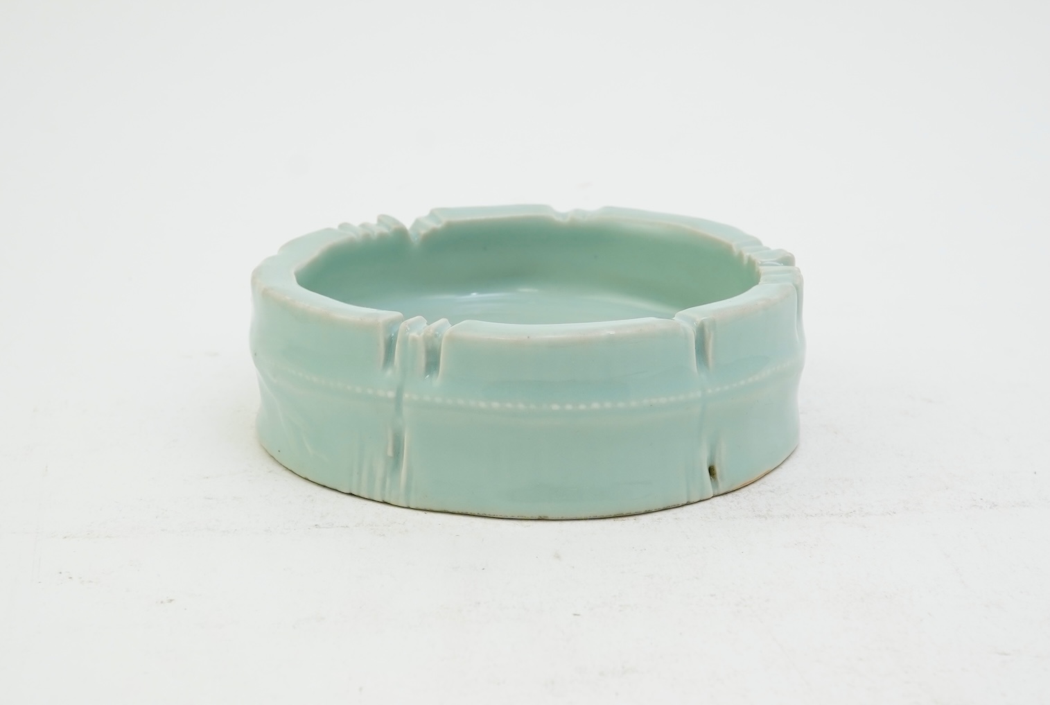 A Chinese celadon glazed brushwasher, Qianlong mark but later